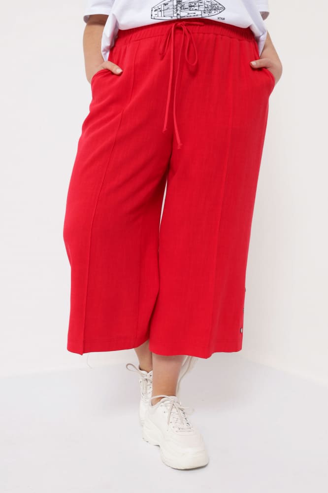 Широкие укороченные брюки на резинке, красные